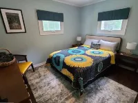 Private Riverfront Home with dock Hotels in Cople