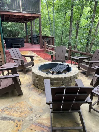 Creekfront Cabin with Waterfall. Hot Tub, Fire Pit, Gameroom, and more.