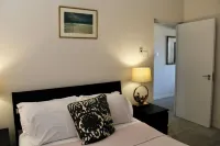 Nestled in the Heart of Fitts Village, Zinnia Becons with the Promise of a Costa Hoteles cerca de Fitts Village Beach