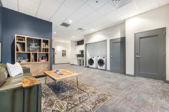 Floor-to-Ceiling Windows and Full Kitchen - Charming Modern Retreat