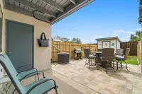 Charming Retreat with Fenced Yard and Partial Ocean Views - Cozy Escape Hotels in Lower Grand Lagoon