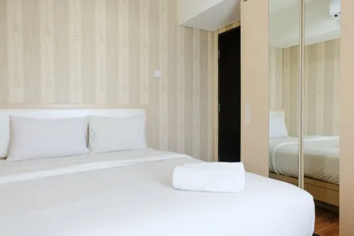 Homey and Cozy 2Br Apartment at Tamansari la Grande