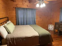 Secluded cozy cabin nestled among the hemlocks and rock formations in Hocking