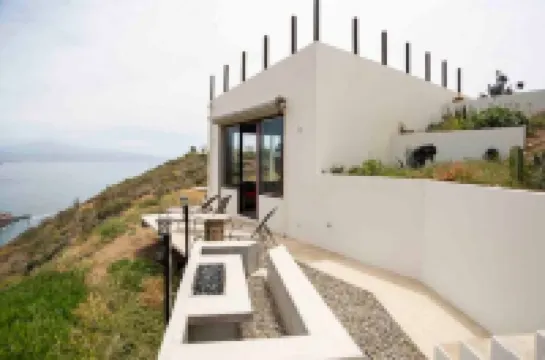 Eclectic Cliffside Den with Hanging Living Area