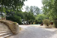 Large garden with swimming pool.