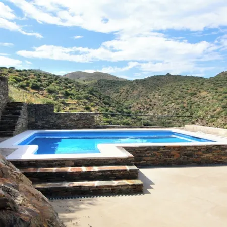 A charming family home with private pool in Cadaques with sea views.