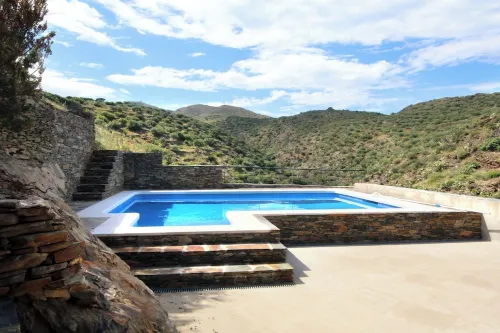 A charming family home with private pool in Cadaques with sea views.