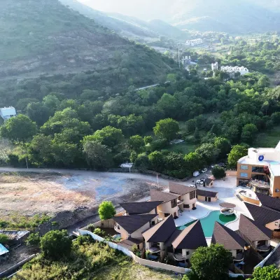 The Qualia Resort Club & Brewery Hotels near Maharana Pratap Airport