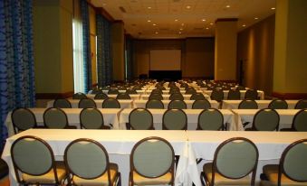 a large conference room with rows of chairs and tables set up for a meeting or event at Isle Casino Hotel Waterloo