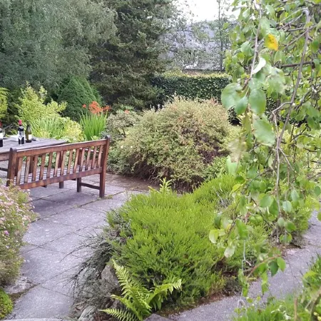 Fabulous house with sun-doors and patio - Large mature garden. Mountain views.