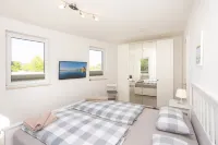 Modern apartment with stunning views of the water and the Rügen Bridge - Homestays