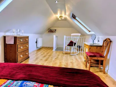 Honeysuckle Cottage with optional hot tub and shared EV charger.