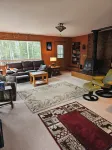 Home nestled in a private forest setting,  mountain views, walk to Kenai Lake.