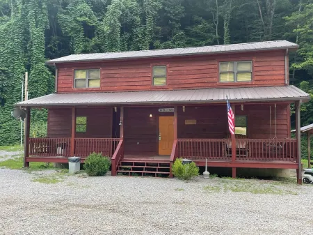 3BR 2 Bath house with full kitchen, living room, and hot tub.