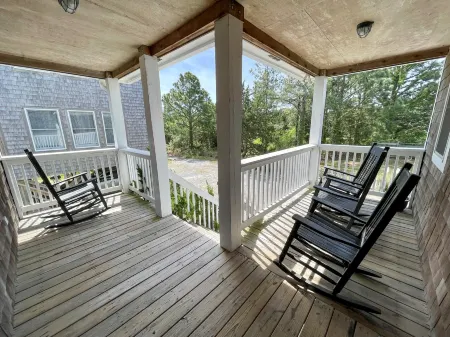 Charming Island Retreat with Spacious Yard and Screened Porches - Inviting Oasis