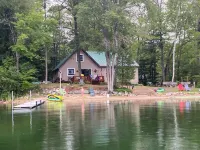 Wonderful house on sandy beach, sports lake close to golf, bike/snowmobile trail