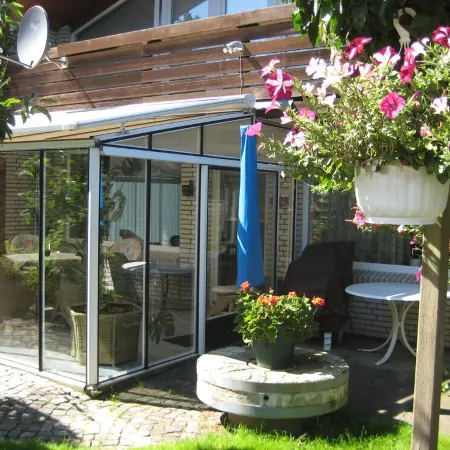 large apartment near the North Sea with conservatory, fireplace, sauna