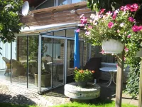 large apartment near the North Sea with conservatory, fireplace, sauna