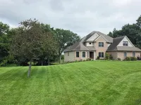 Luxury 5 BR home on private wooded lot near QC, w/hot tub, rec & fitness room Hotels in Henry County