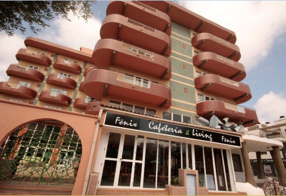 "a large building with many windows and a sign that says "" pelli cafelonare living "" on it" at Alegria