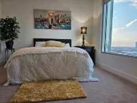 Downtown Luxury High-Rise Retreat: Panoramic City Views & Modern Amenities