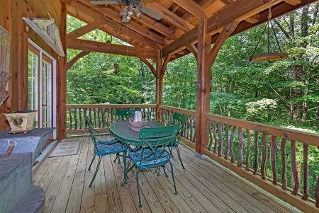 A Laurel Haven, with big porches and a log cabin feel. Fireplace.
