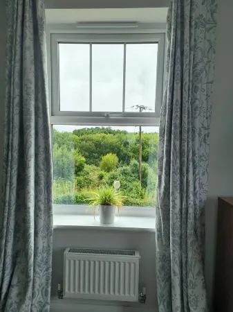 Large, light and airy room with kingsize bed & lovely views of the countryside.