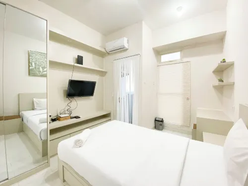 Minimalist and Homey Studio Room at Amartha View Apartment