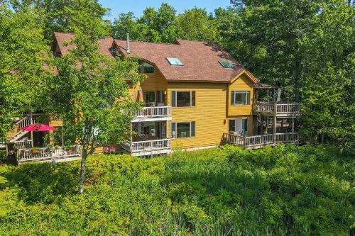 Elk Rapids Condo w/ Balcony Overlooking Elk Lake! - Wifi