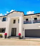 This Miami Vice Villa home is a stunning Saltwater Heated pool/Jacuzzi spa Oasis