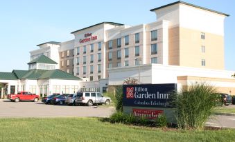 a large hotel with a parking lot in front of it , possibly a hilton garden inn at Hilton Garden Inn Columbus/Edinburgh