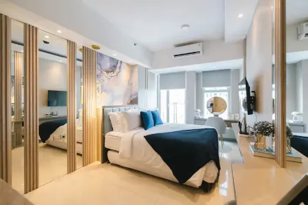 PakuwonMall Apartment @Anderson 2BR by B&B Host Отели рядом с достопримечательностью «Universitas Ciputra Surabaya»