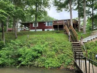 Secluded Lake of the Ozarks Vacation Home Waterfront with a Covered Dock.