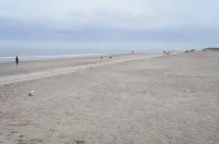 30 Steps to the Beach! Luxury Condo with Large wrap-around porch!