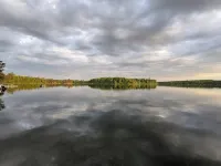 Tiny bungalow secluded in the woods with lake view.  Pets accepted!