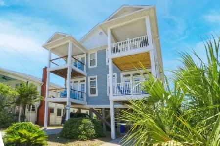 Luxury 4 bedroom townhome with ocean view steps away from the beach!