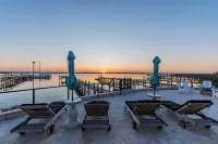 Waterfront home with dock, heated pool, & spectacular views- walk/bike downtown!
