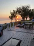 Enjoy Beautiful Sunsets at this Lake House w a HOT TUB, Boat Garage and Game Rm