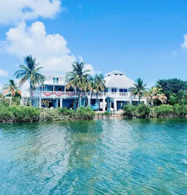 Oceanfront Gated Corner lot Amazing Sunsets. 90” BoatDock & 12 person Swim Spa!
