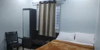 Iroomz Hotel Partha Grand Hotels near KMC Park DHANALAKSHMI NAGAR