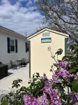 Relax here with beach views, steps to the beach, fenced in yard, pet friendly