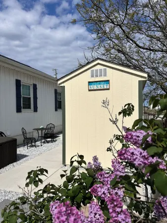 Relax here with beach views, steps to the beach, fenced in yard, pet friendly