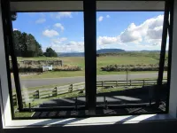 Apartment with lake, mountain & rural views.