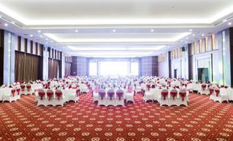 a large banquet hall with rows of tables and chairs set up for a formal event at Muong Thanh Grand Hoang Mai - Nghe An