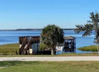 Watch Florida sunsets from the covered lakefront dock Hotels in Minneola