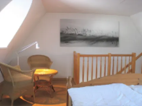 Vacation apartment in a thatched house, directly on the beach for 2-4 people