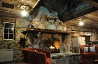 Cozy up in this rustic Stone Lodge and relax by the fireplace