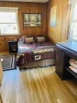 Stay in this charming vintage cabin with a wood burning fireplace,