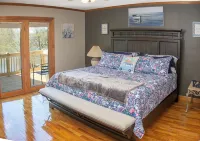 Pristine lake house offering watersports, gameroom favorites, and stunning view