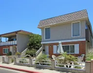 Spacious Living Area and Front Patio - Cozy Family Retreat